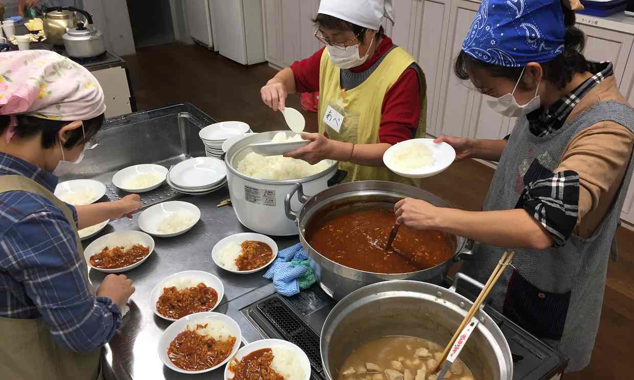 Volunteers prepare meals at a children’s cafeteria in Kawaguchi, Saitama prefecture, Japan. Photograph: Justin McCurry for the Guardian