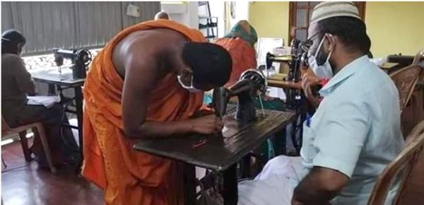 A Buddhist Monk and an Islamic priest sewing face masks .