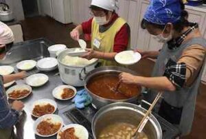 Volunteers prepare meals at a children’s cafeteria in Kawaguchi, Saitama prefecture, Japan. Photograph: Justin McCurry for the Guardian