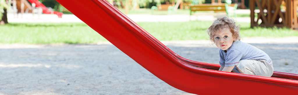 baby on slide at park